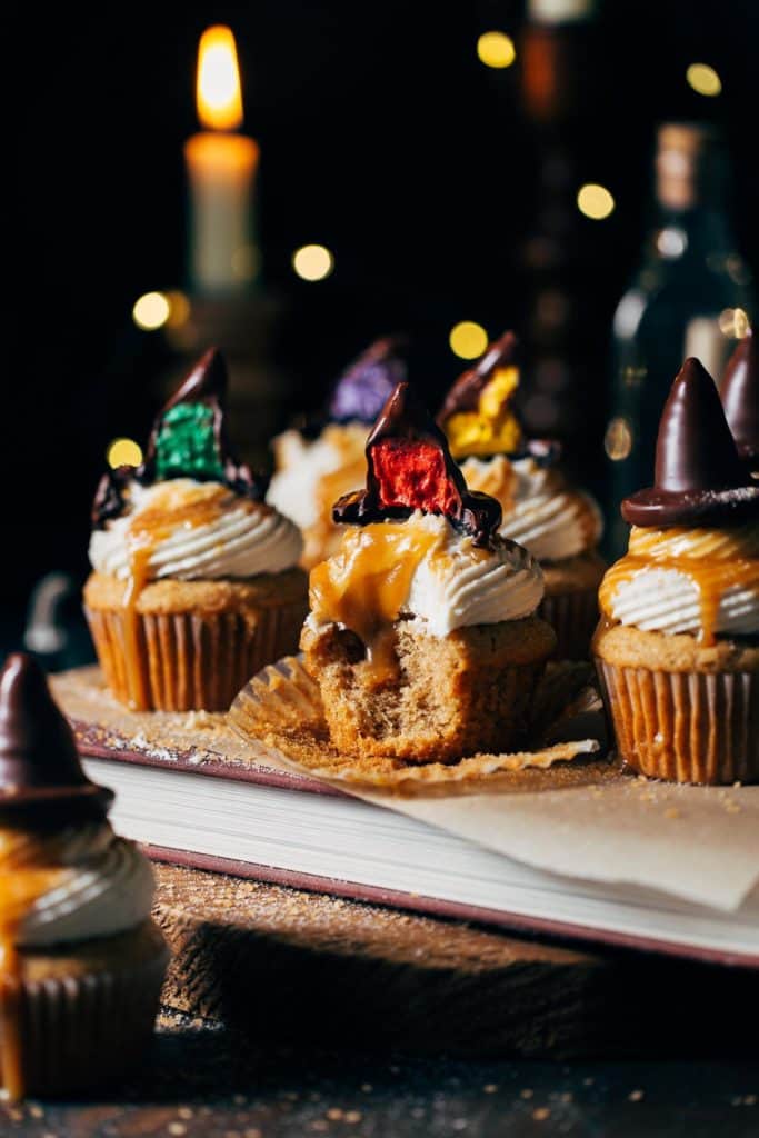 butterbeer cupcakes with buttercream filled sorting hats on top