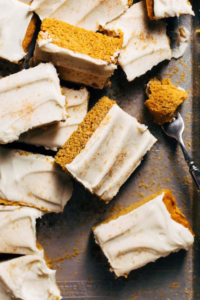 pumpkin bars scattered on a baking tray