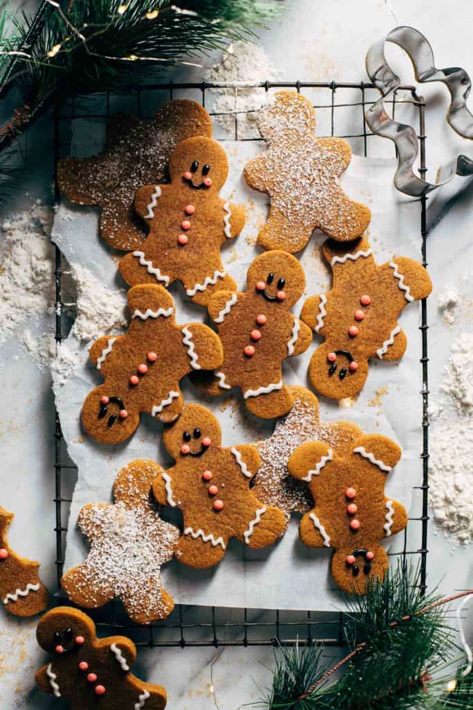 decorated gingerbread men cookies on a cooling rack