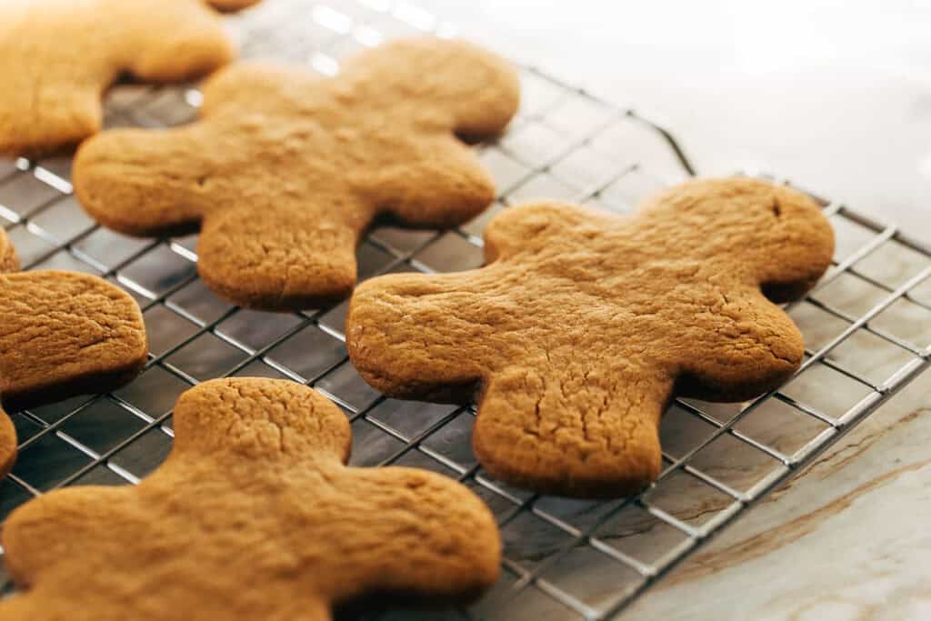 cooled gingerbread cookies on a wire rack