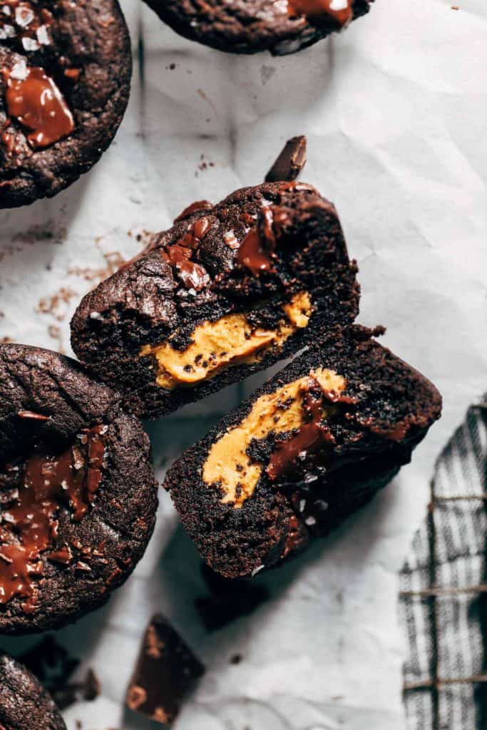 the inside of a chocolate cookie cup filled with peanut butter