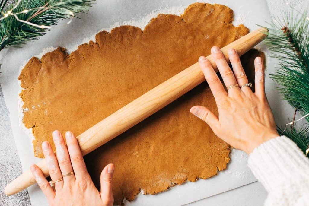 rolling out gingerbread cookie dough