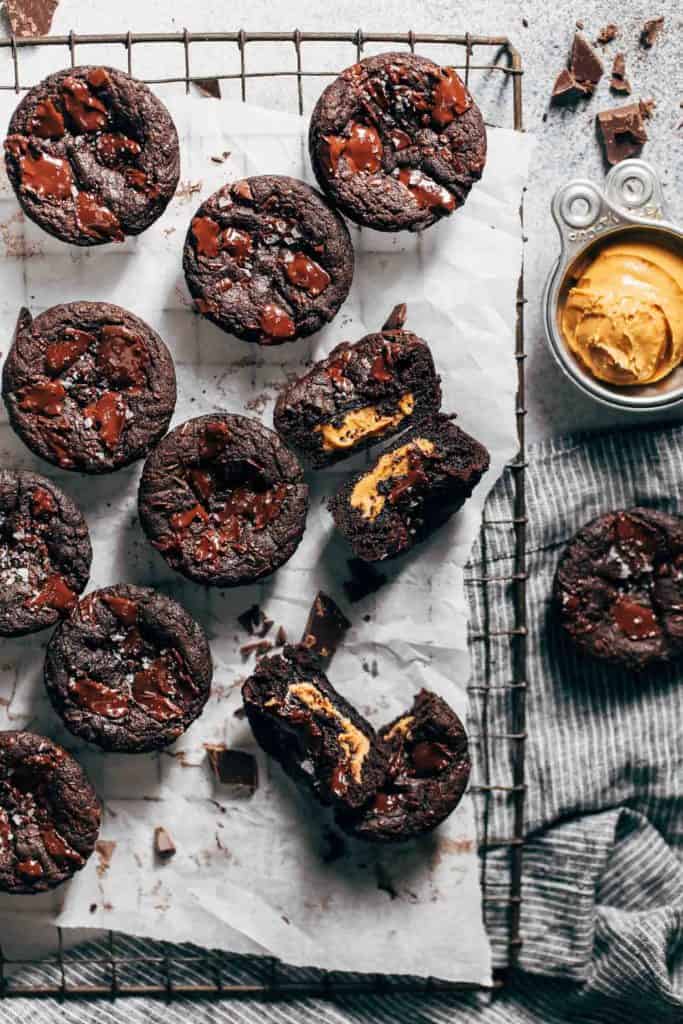 chocolate cookie cups scattered on parchment paper