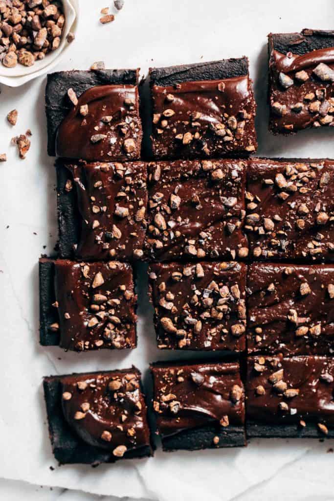 sliced chickpea brownies topped with chocolate ganache