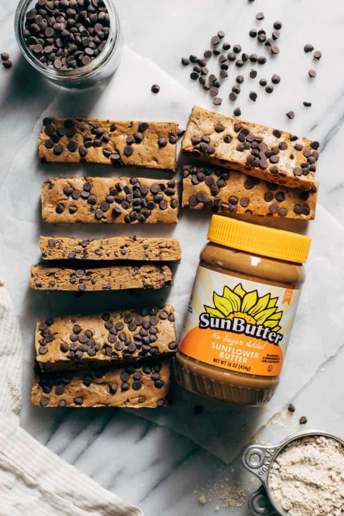 protein bars with a jar of sunflower seed butter