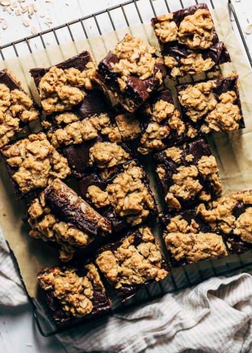 oatmeal fudge bars cut into squares and scattered on a cooling rack