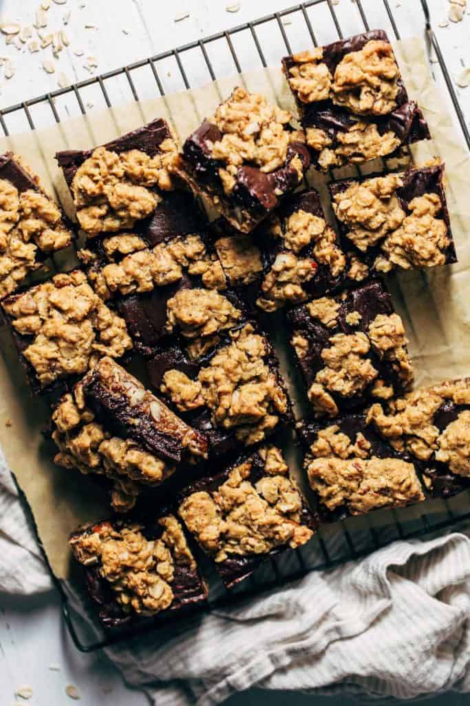 oatmeal fudge bars cut into squares and scattered on a cooling rack