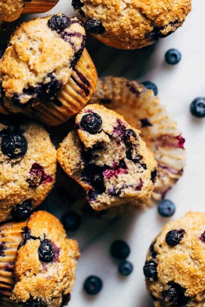 a bite taken from a blueberry muffin