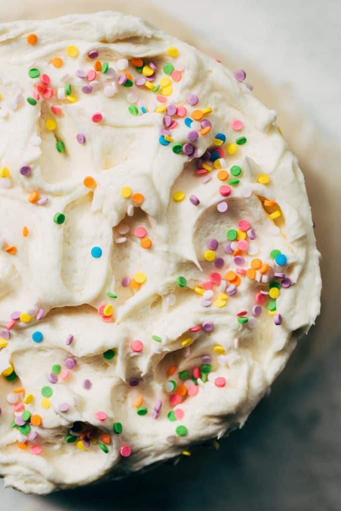 the top of a vanilla cake with swirls of vanilla buttercream
