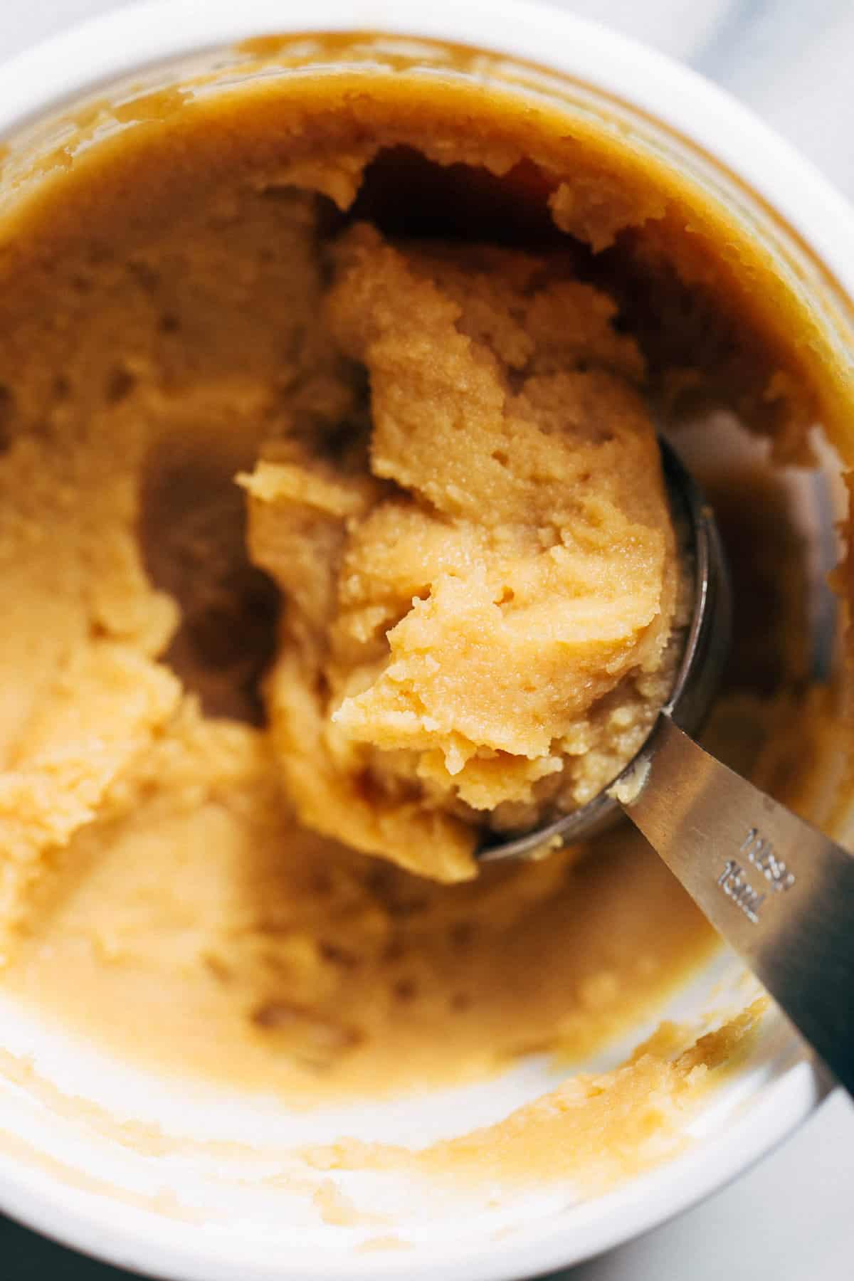 close up on miso paste in a container