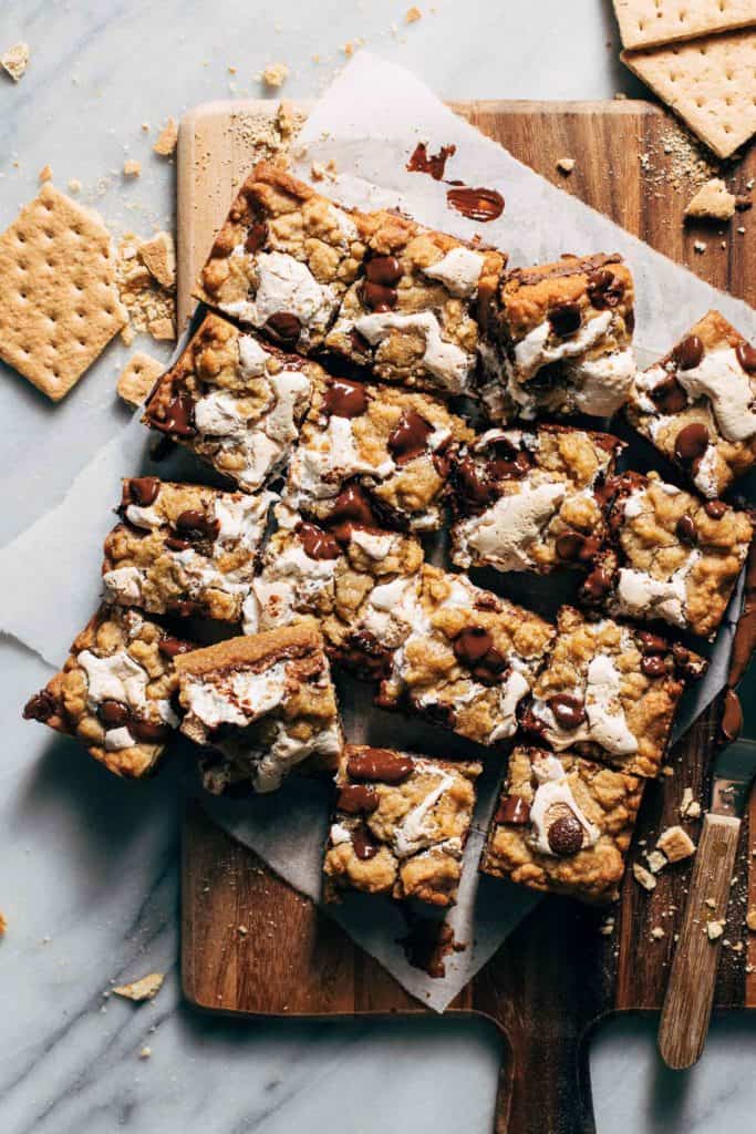 sliced smores bars on a wood tray