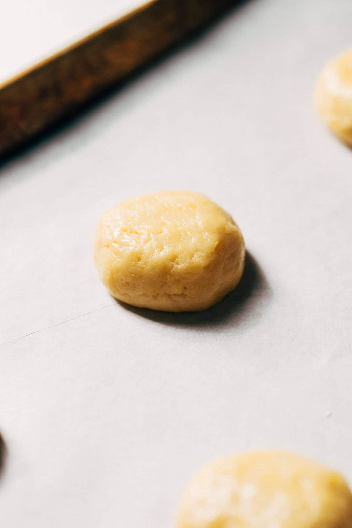 lemon sugar cookie dough on a baking pan
