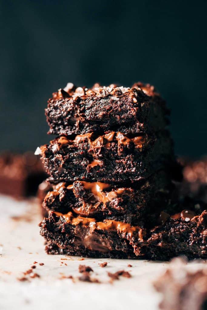 a stack of fudgy vegan brownies