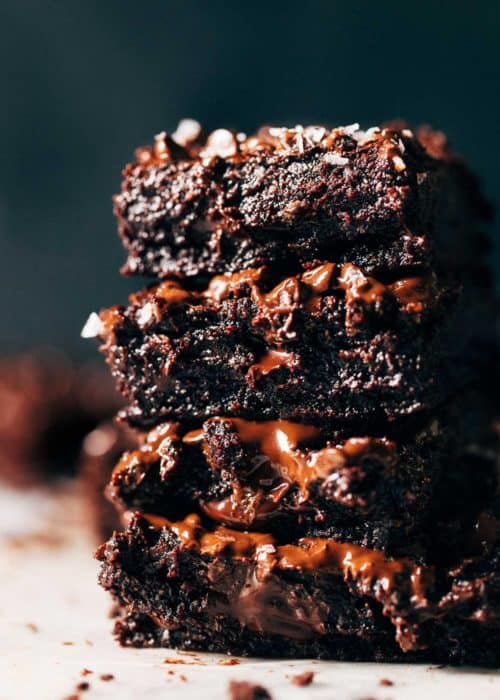 close up on a stack of super fudgy vegan brownies