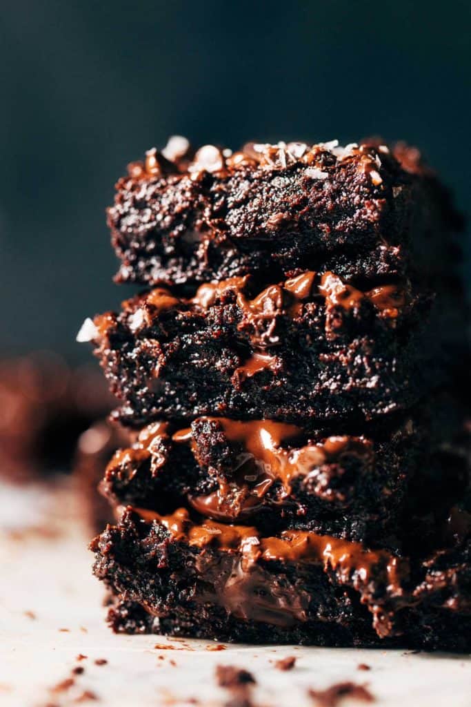 close up on a stack of super fudgy vegan brownies