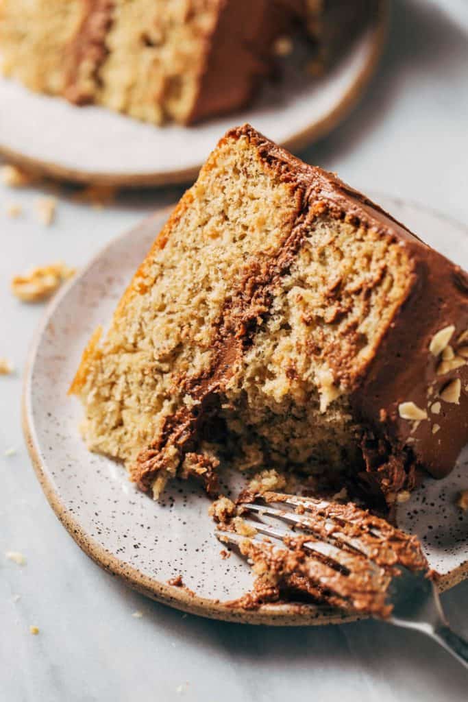 a bite taken from a slice of banana cake