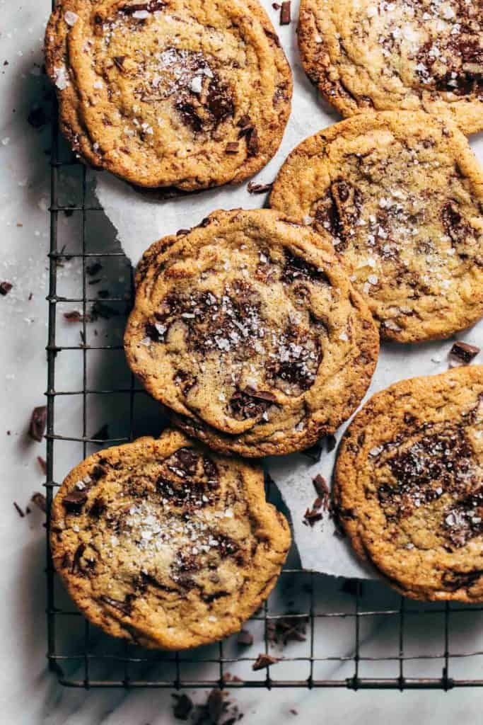 crispy chocolate chip cookies on a cooling rack