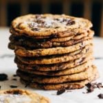 a stack of thin and crispy chocolate chip cookies