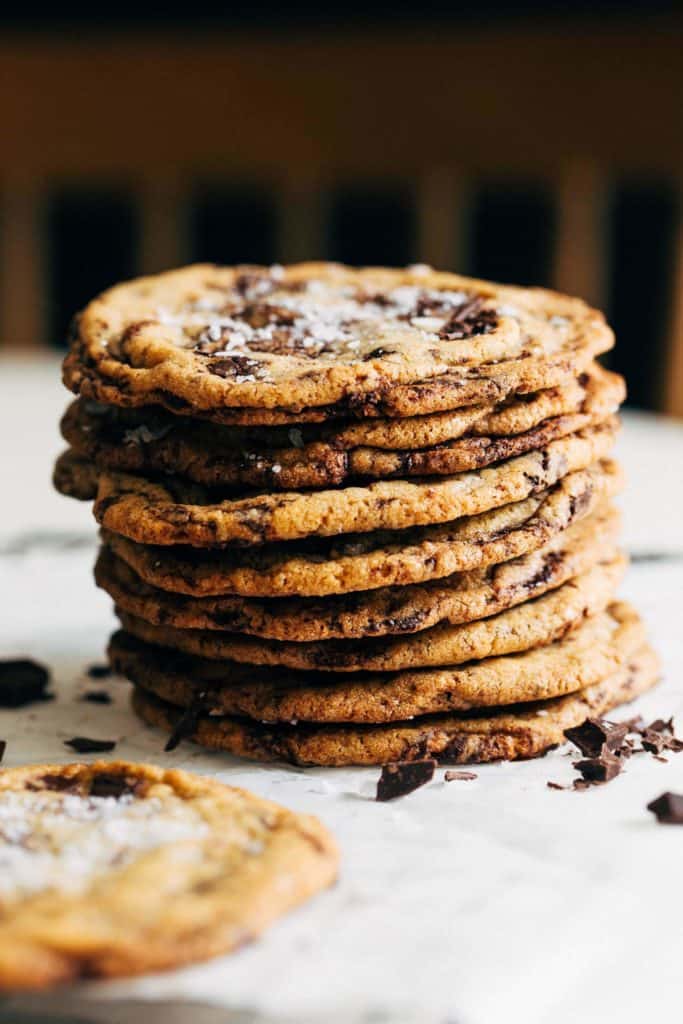 a stack of thin and crispy chocolate chip cookies