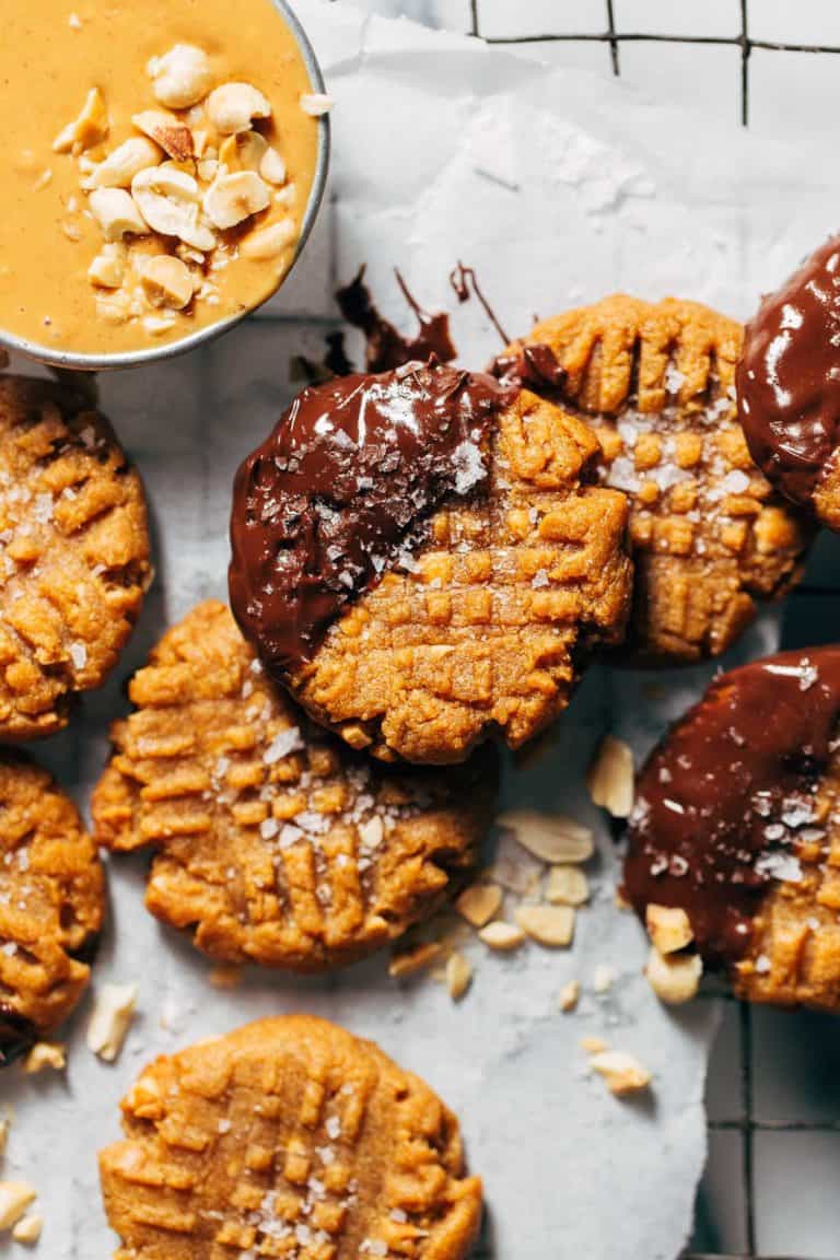 flourless peanut butter cookies scattered on a cooling rack