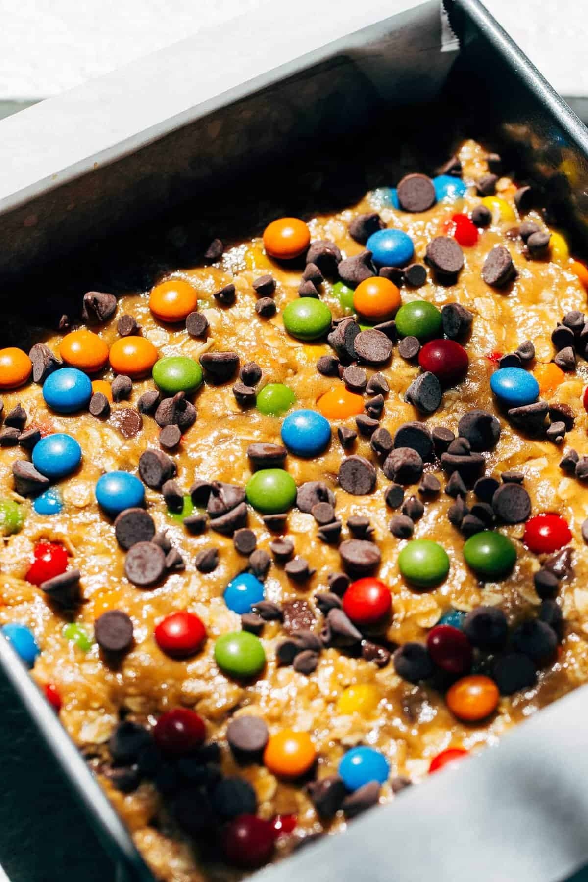 monster cookie dough pressed into a baking pan
