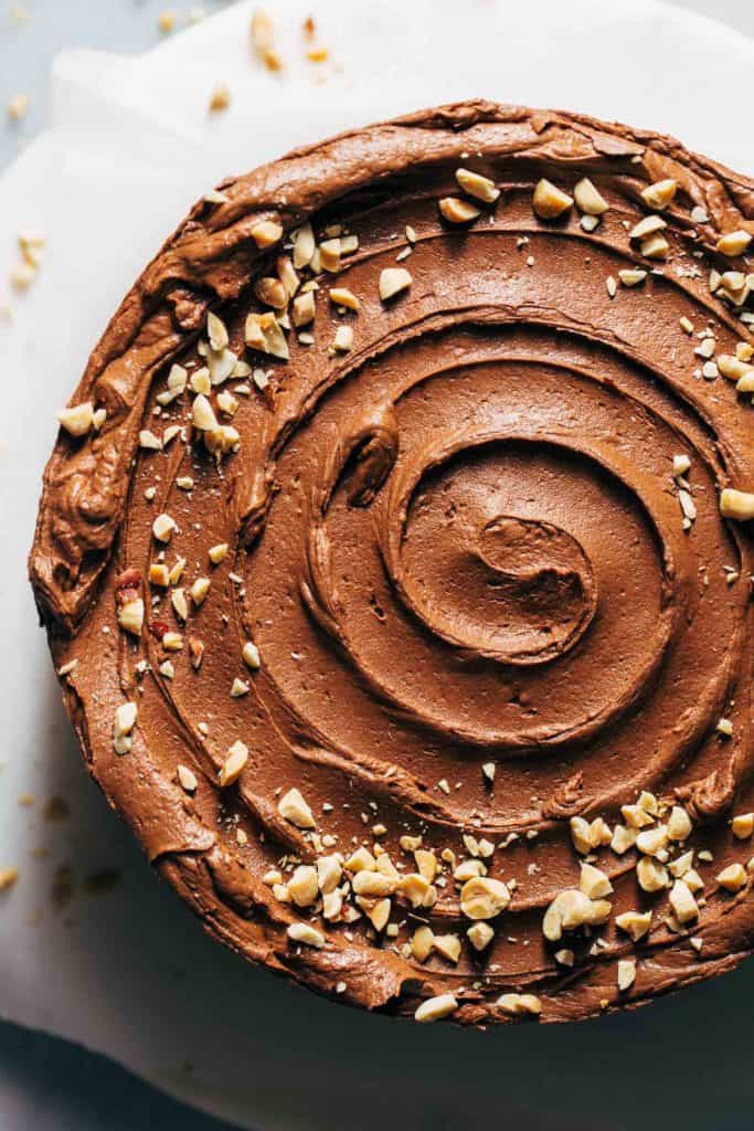 the top of a banana cake with a swirl of peanut butter chocolate frosting