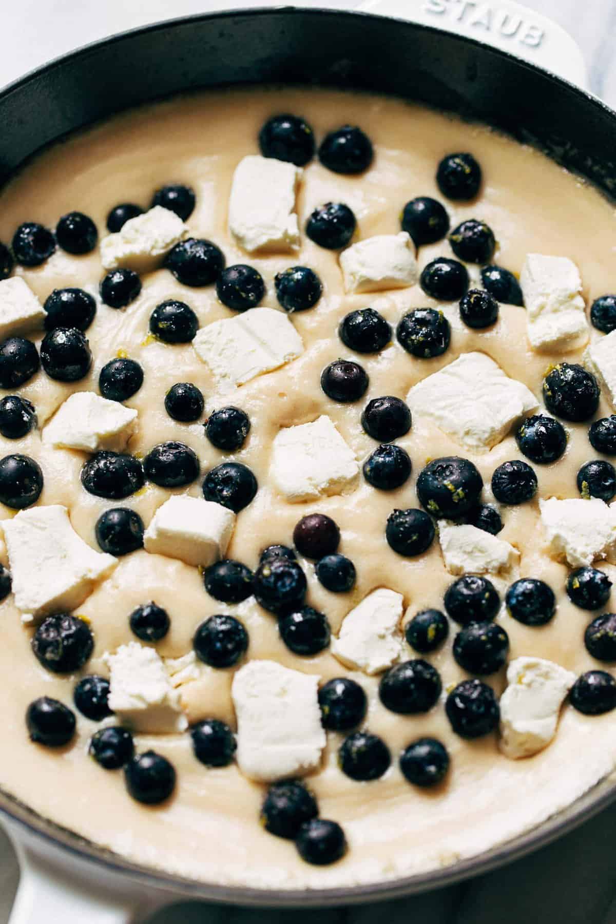 cream cheese chunks in blueberry cobbler batter