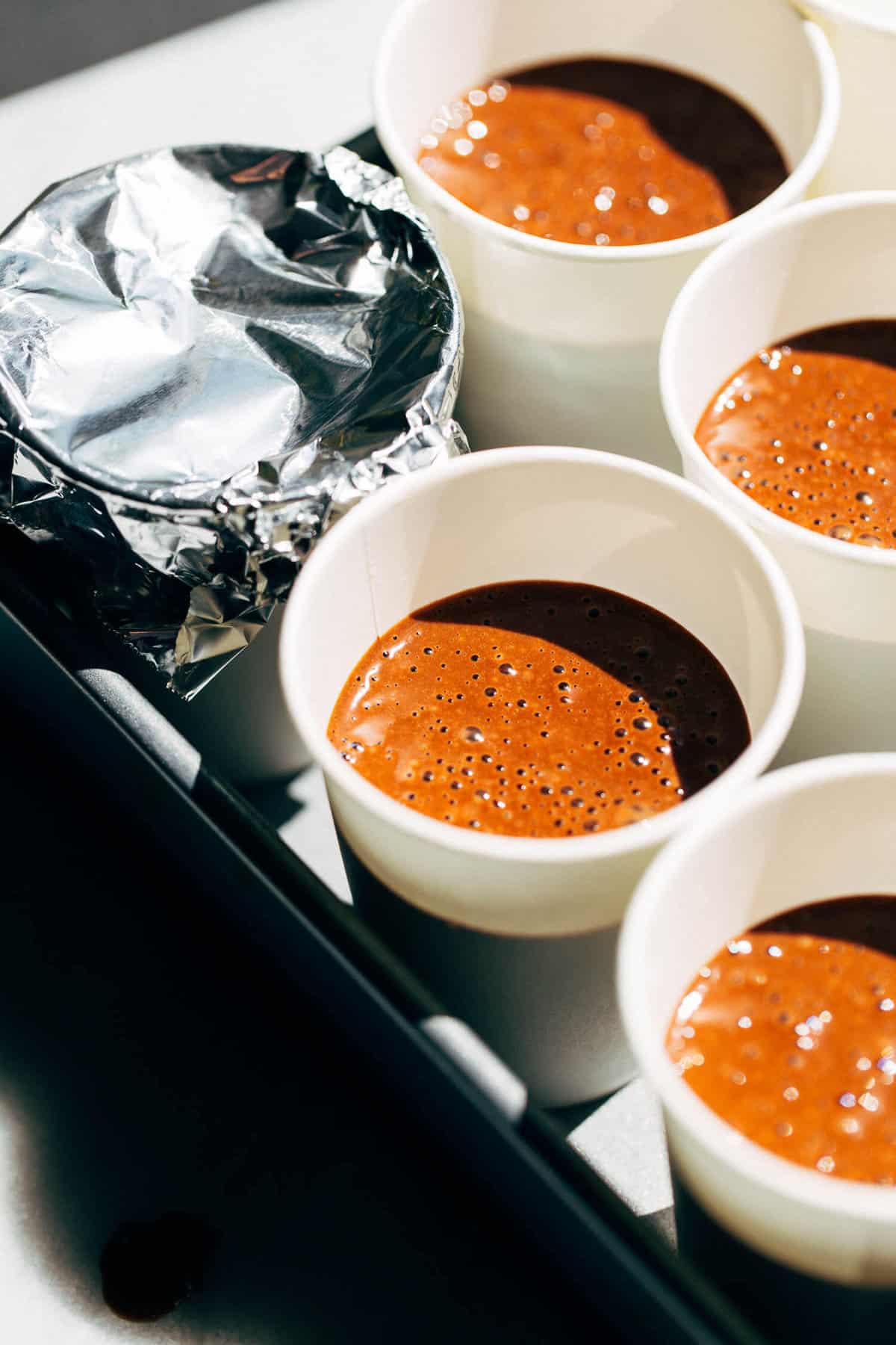 chocolate pudding poured in to paper cups