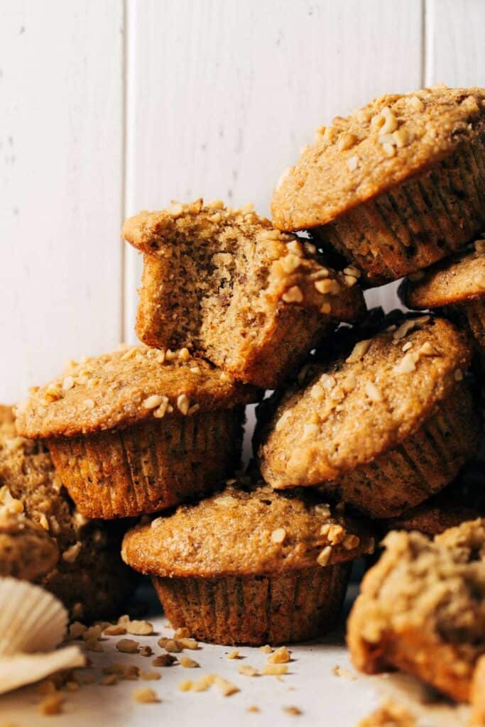 banana nut muffins stacked on top of each other