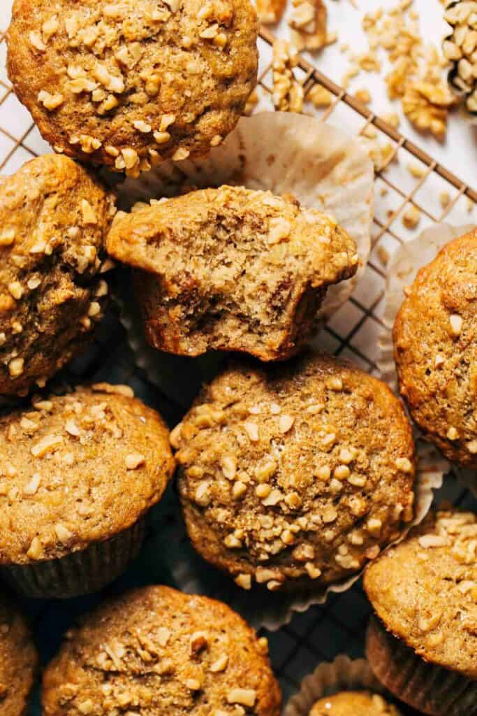 the tops of banana nut muffins topped with extra nuts
