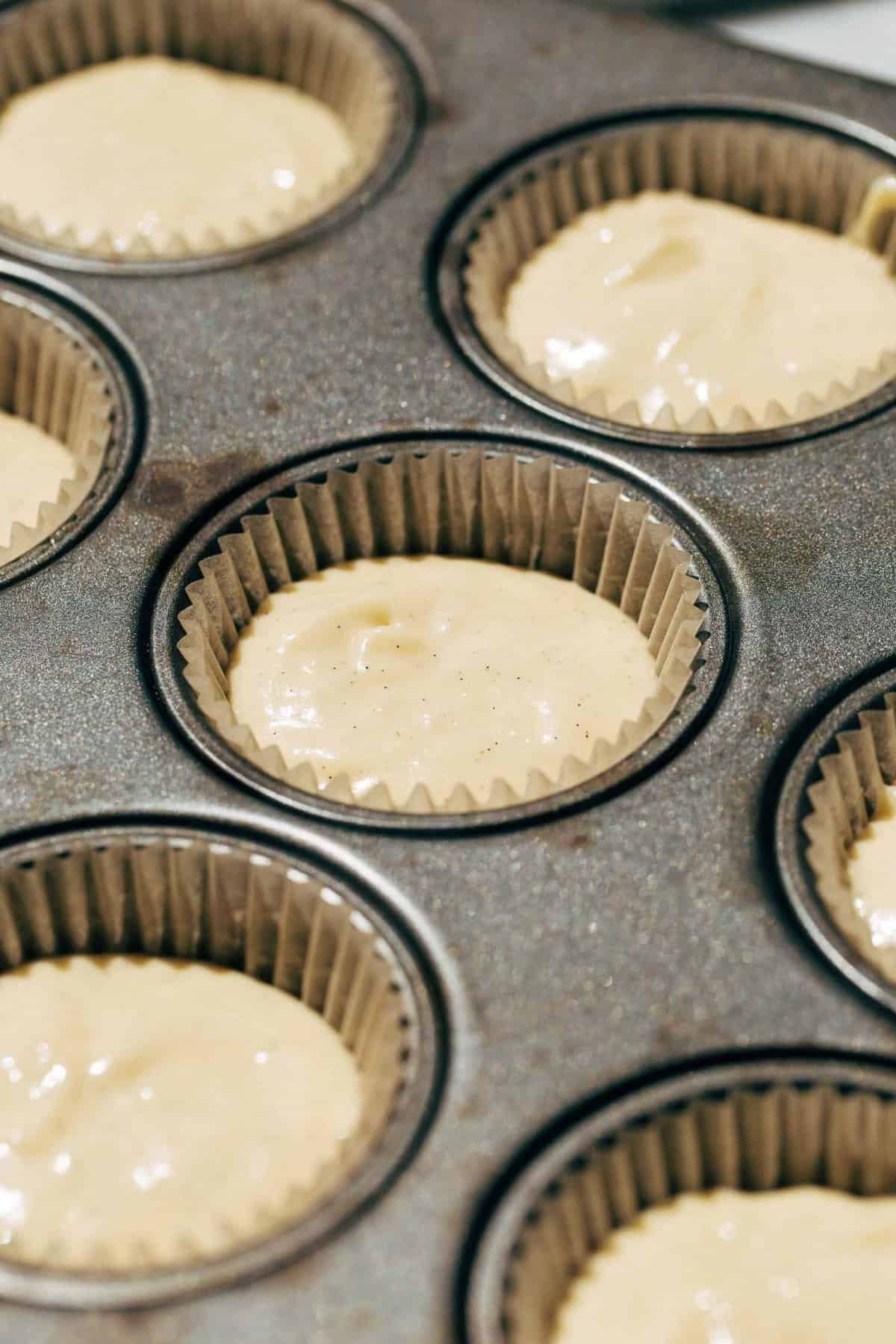 vanilla cupcake batter in a cupcake pan