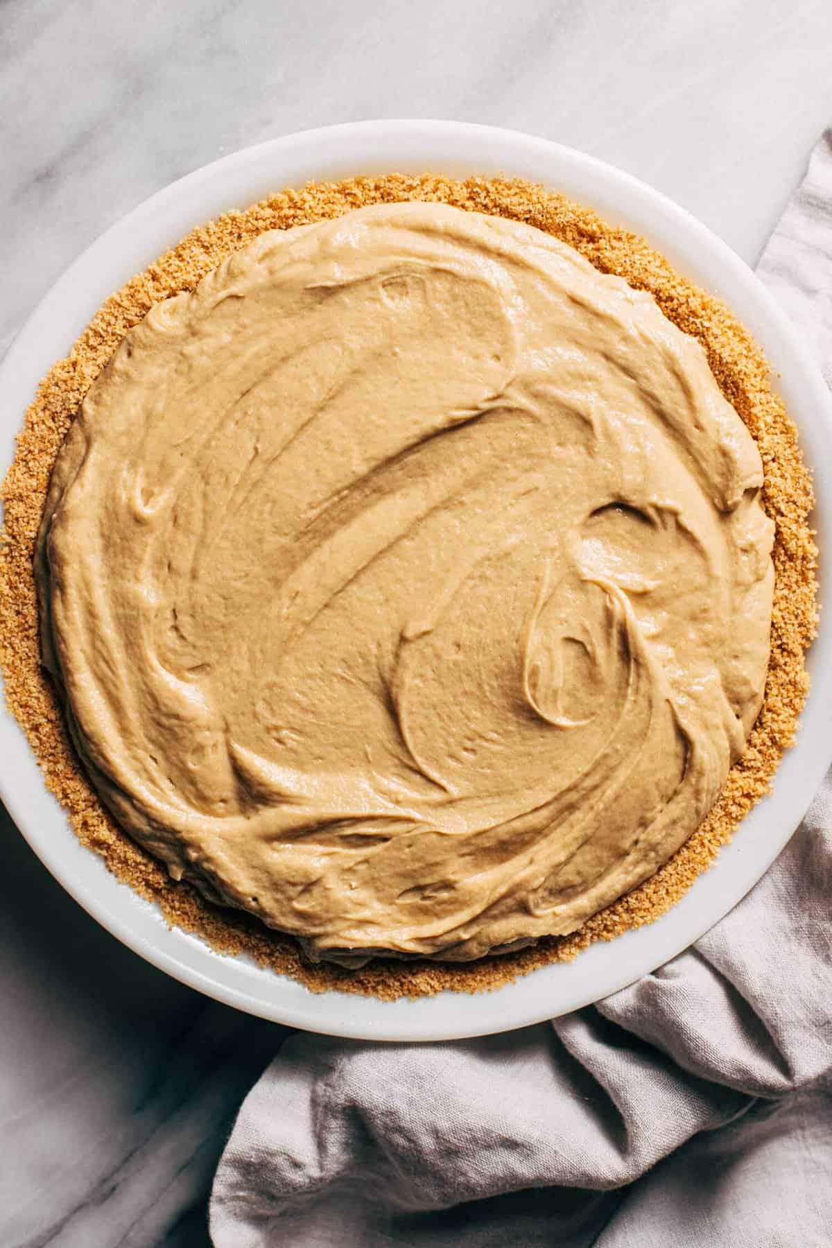 no bake sunbutter pie filling in a graham cracker crust