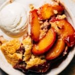 a bowl of fresh peach cobbler