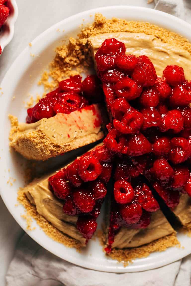 the top of a sliced sunbutter and raspberry pie