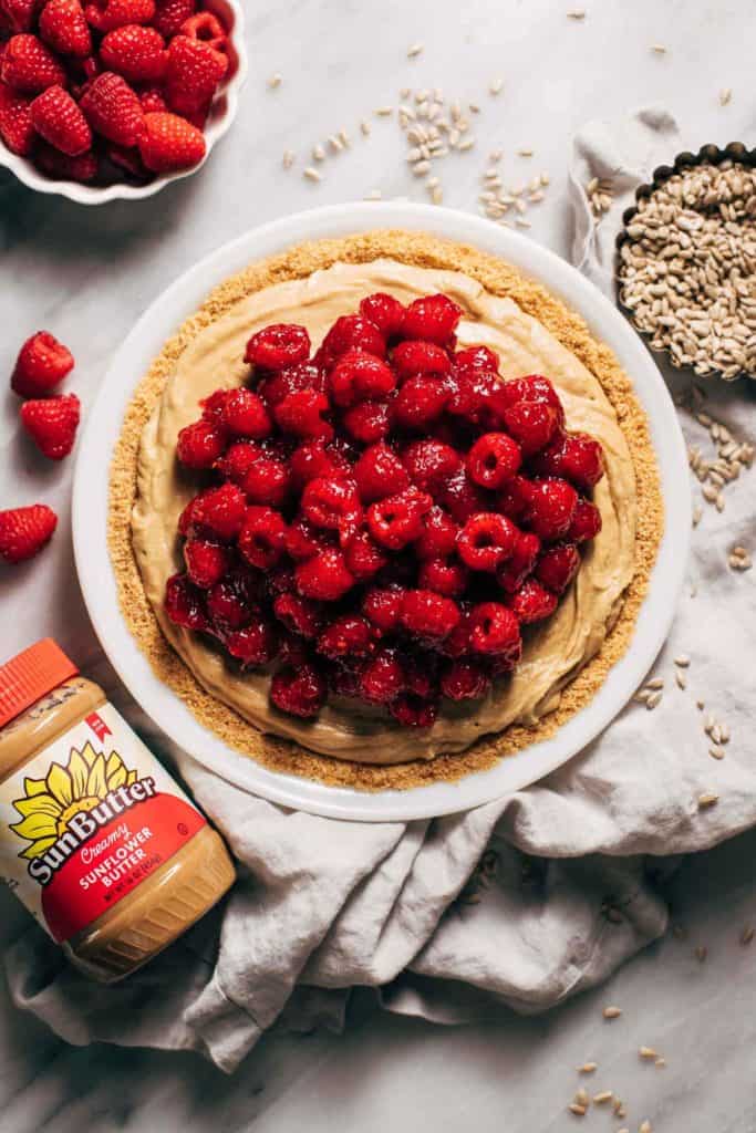 the top of a sunbutter pie topped with raspberries