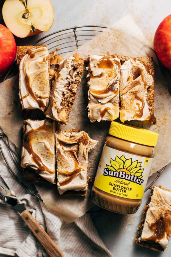 slices of apple blondies with frosting spread on top