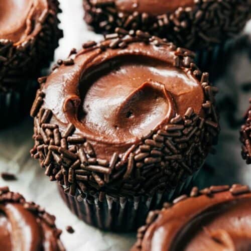 chocolate frosting swirled on top of a chocolate cupcake