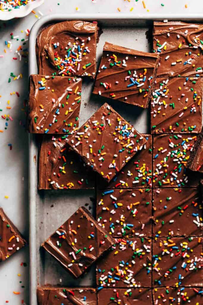 slices of lunch lady brownies scattered in a baking sheet