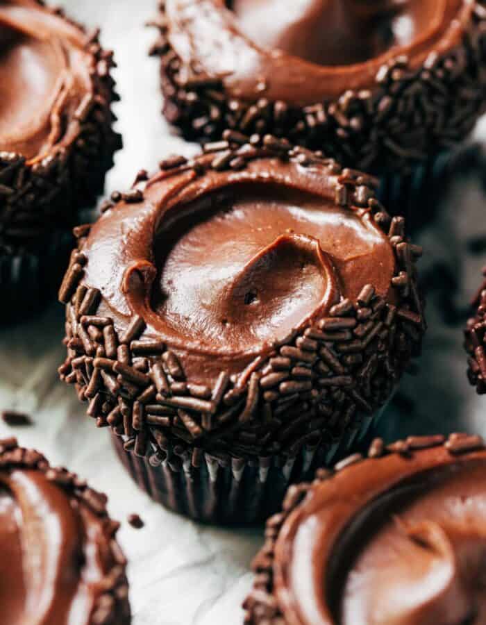 chocolate frosting swirled on top of a chocolate cupcake