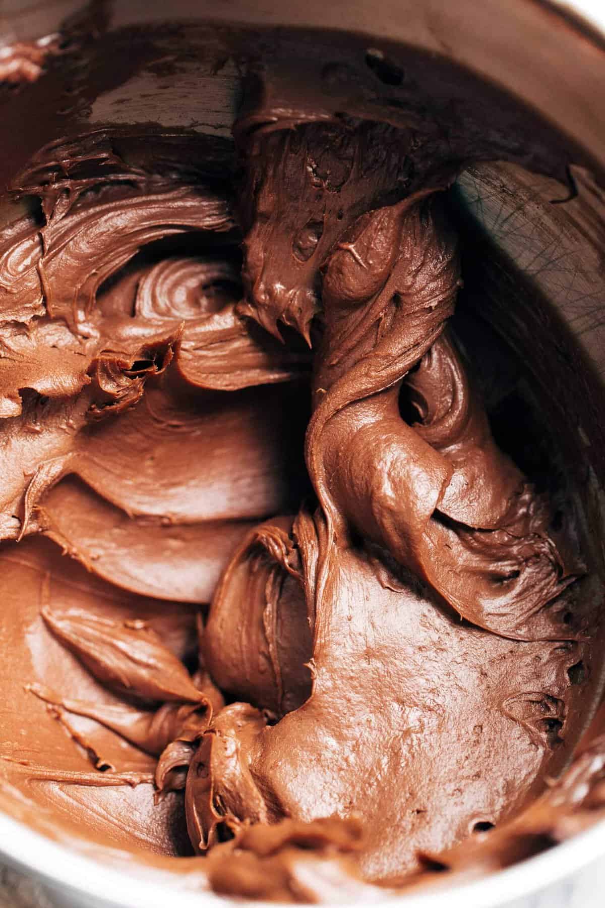 a bowl of chocolate sour cream frosting