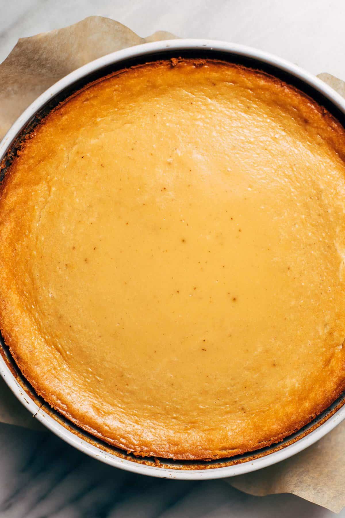 the top of a freshly baked maple brown butter cheesecake