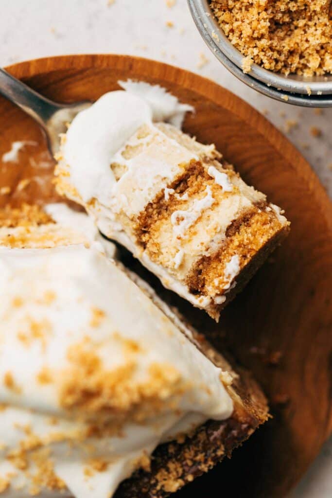 a bite of maple cheesecake with a double brown butter graham cracker crust