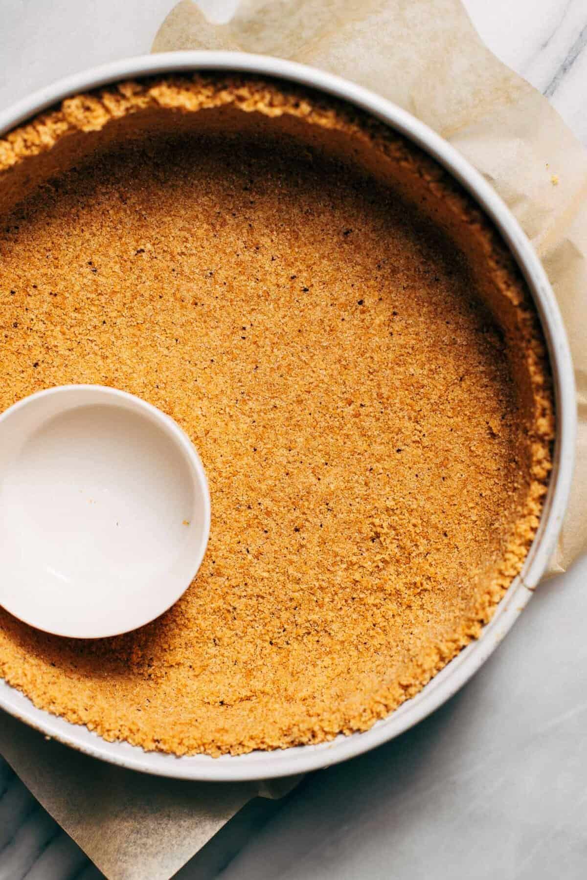 brown butter graham cracker crust pressed into a springform pan
