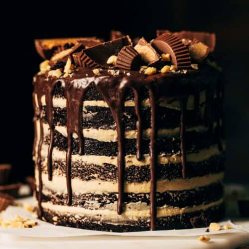a 6 layer chocolate cake with peanut butter frosting and chocolate cake drip