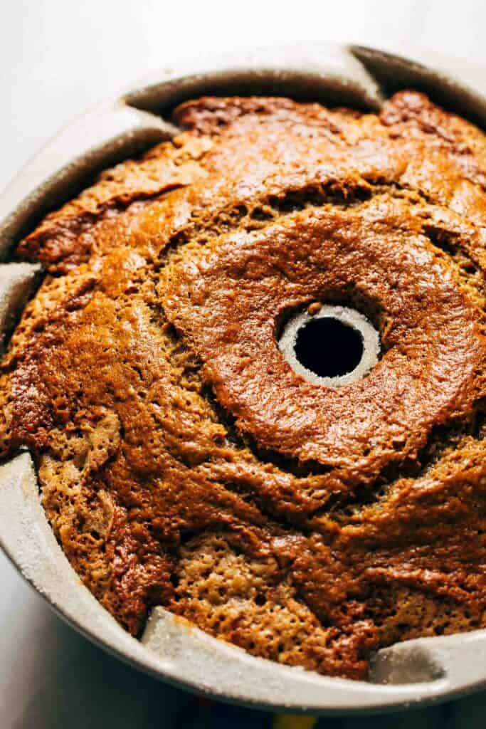 a freshly baked banana bundt cake still in its pan