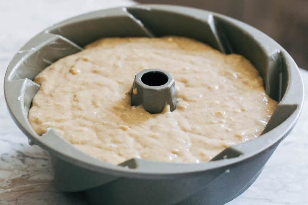 banana cake batter in a bundt pan