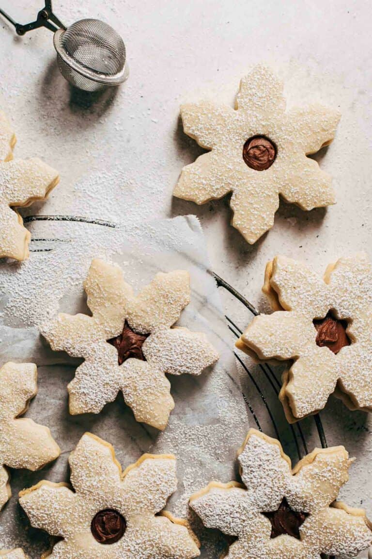 snowflake cookies on a cooling rack