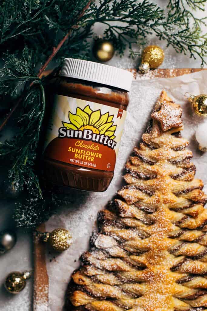 a jar of chocolate SunButter with a puff pastry christmas tree