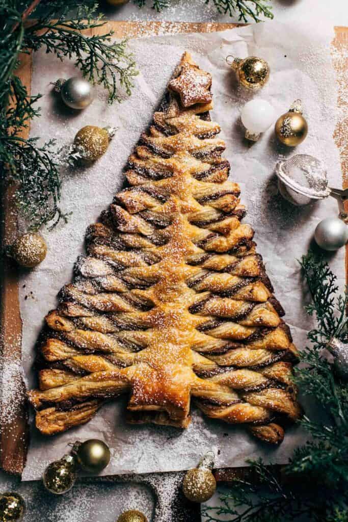 a puff pastry christmas tree on a serving board