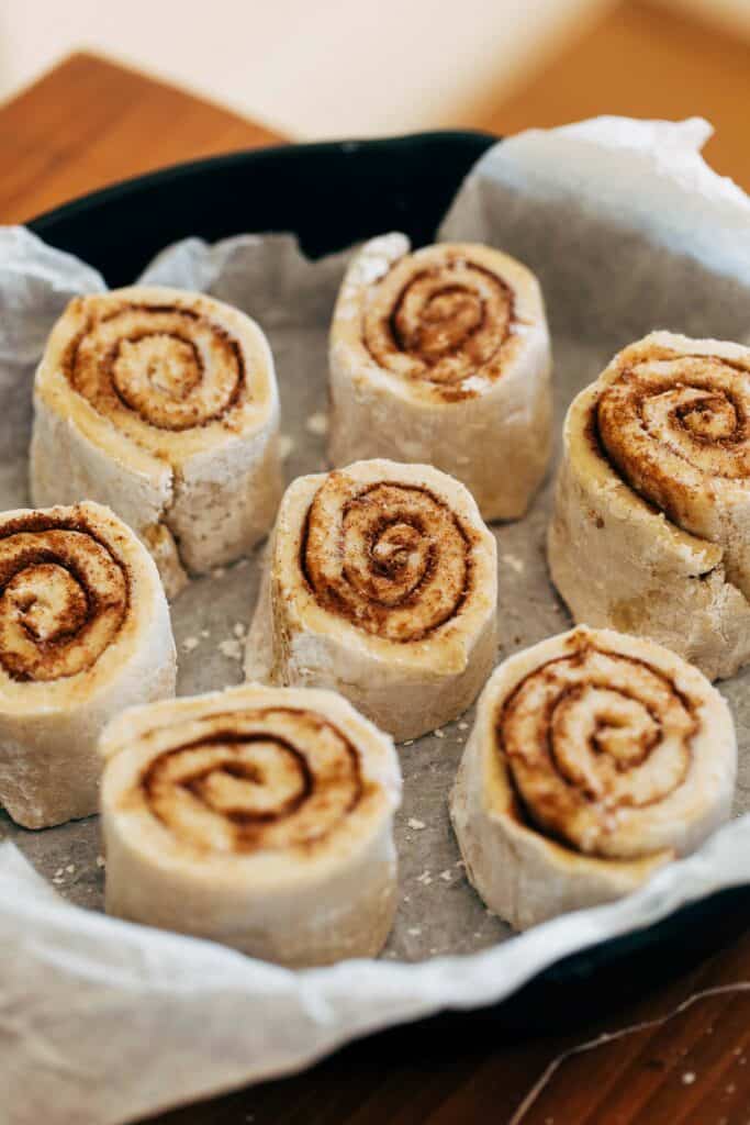 cut cinnamon roll dough in a skillet